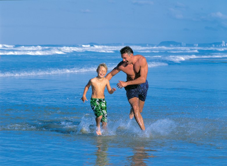 Family playing at the beach